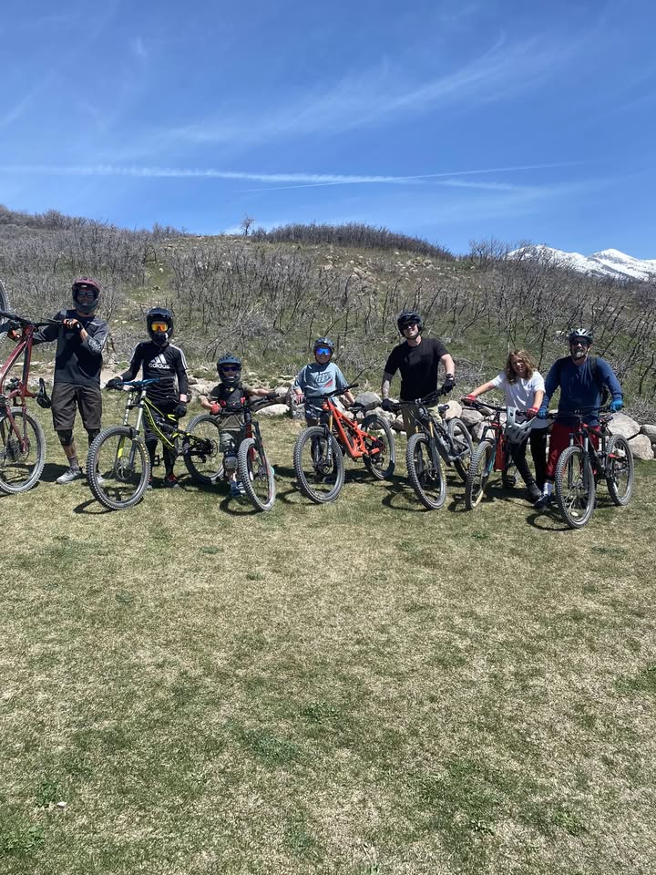 The Mountain Militia crew with their bikes on a trail in the Utah foothills